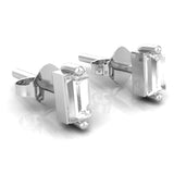 Close up of baguette diamond stud earring showing step cut facets and ball tip prong setting