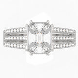 Top view of TR028 pie-cut emerald diamond ring, large seamless step-cut cluster on four prongs, triple pavé split band shoulders, F–G VS clarity, 18kt gold