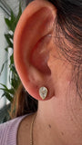 18KT yellow Gold Illusion Pear Diamond Bezel Stud Earrings on ears face down 