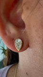 18KT yellow Gold Illusion Pear Diamond Bezel Stud Earrings on ears face down  close up