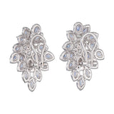 back view of floral earrings with diamonds & blue sapphires
