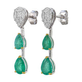 Side profile of 18kt gold Zambian emerald and diamond illusion drop earrings AE224, showing 1 inch total length, bar connector between diamond cluster top and two graduating emerald pears, push-back post fitting
