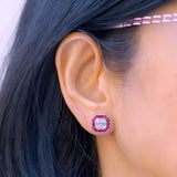 18kt gold pie-cut diamond and invisible set ruby halo stud earrings worn, AER064 showing full octagonal face with seamless ruby border, available in yellow white and rose gold, Trinity Designer Jewel Bangkok