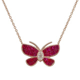 Front view of ANK029 ruby butterfly pendant, calibré-cut natural rubies invisibly set across four wings, marquise diamond bezel body, 18kt gold