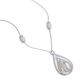 Close-up of ANK090 Allah calligraphy pendant, round brilliant diamond pavé script on mother of pearl pear panel, double diamond border frame, 18kt white gold