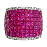 Top view of AR1486 invisible set ruby band ring, full dome face covered in calibré ruby invisible setting, diamond pavé border top and bottom, 18kt white gold