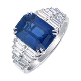  blue sapphire ring showing double row baguette diamond shoulders and claw setting