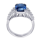 Side profile of blue sapphire ring showing baguette diamond shoulders rows in claw setting