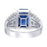 Back view of natural sapphire cocktail ring with graduating baguette diamond shoulders 18kt white gold