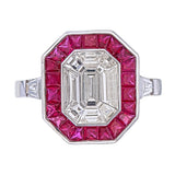 Emerald Shape Baguette Illusion Diamond Ring with Calibre Cut Ruby Border and Side Baguettes front close up 