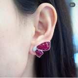 Close-up of natural ruby invisible setting on AER069 fan earring, calibré-cut rubies set edge to edge with no visible metal, 8ct total per pair