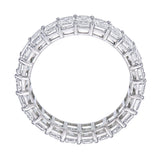 Close up of emerald cut diamonds in shared prong platinum eternity band showing clarity and setting detail