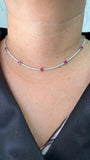 18kt white gold natural ruby diamond station necklace  on neck close up