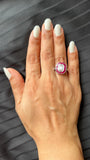 Emerald Shape Baguette Illusion Diamond Ring with Calibre Cut Ruby Border and Side Baguettes on hand image
