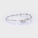 18kt gold natural diamond flower half bangle bracelet AB035 rotating 360 degrees — 0.60ct round brilliant diamonds in continuous pavé row with four raised flower cluster motifs, hinged clasp, available in yellow white and rose gold, custom fine jewellery made in Bangkok Thailand