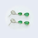 18kt gold Zambian emerald drop earrings AE224 rotating 360 degrees — marquise princess diamond illusion pear cluster top, two graduating natural Zambian emerald pear drops on bar connector, yellow gold prong detail, 2.60ct total, fine jewellery made in Bangkok Thailand