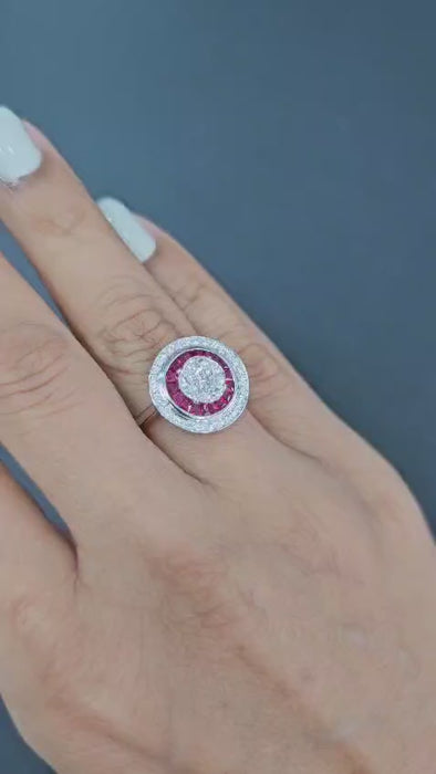 Invisible set ruby diamond ring worn on hand showing double halo design in 18kt gold 