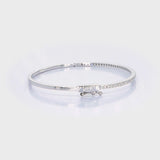 18kt white gold pavé diamond bangle bracelet rotating 360 degrees showing diamond brilliance and hinged clasp, custom fine jewellery manufacturing