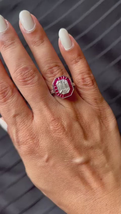 Emerald Shape Baguette Illusion Diamond Ring with Calibre Cut Ruby Border and Side Baguettes on hand video